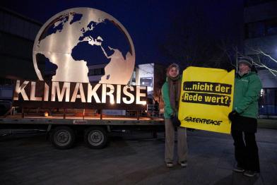 Protest with burning earth symbol at TV duel of chancellor candidates in Berlin